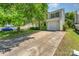 View of the front of a two-story home featuring a garage and driveway with cars parked outside at 12016 Gemstone Ct, Charlotte, NC 28269