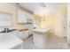 Spacious kitchen featuring an island, ample counter space, and a view to the yard at 12016 Gemstone Ct, Charlotte, NC 28269