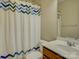 Bathroom features a neutral color scheme, a sink and a patterned shower curtain at 1222 Kings Bottom Dr, Fort Mill, SC 29715