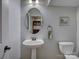 A charming bathroom featuring a pedestal sink and a wall-mounted towel ring at 1222 Kings Bottom Dr, Fort Mill, SC 29715