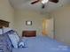 Bedroom featuring carpet, blue bedding and a view to an adjacent room through a doorway at 1222 Kings Bottom Dr, Fort Mill, SC 29715