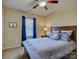Bedroom featuring carpet, blue and white patterned bedding and a window with blue curtains at 1222 Kings Bottom Dr, Fort Mill, SC 29715