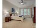 Serene bedroom with a ceiling fan, large windows, and plush carpeting at 1222 Kings Bottom Dr, Fort Mill, SC 29715