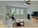 Bonus room with a ceiling fan, large TV, and lots of space at 1222 Kings Bottom Dr, Fort Mill, SC 29715