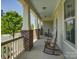 Relaxing covered porch with rocking chairs and brick pillars at 1222 Kings Bottom Dr, Fort Mill, SC 29715