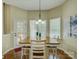 Bright and airy dining area with a modern chandelier and easy access to the outdoor deck at 1222 Kings Bottom Dr, Fort Mill, SC 29715