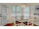 Bright dining area features an elegant chandelier and a door to the outside at 1222 Kings Bottom Dr, Fort Mill, SC 29715