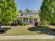Charming two-story home with landscaped front yard and inviting porch at 1222 Kings Bottom Dr, Fort Mill, SC 29715
