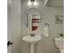 Cozy half bathroom with pedestal sink and decorative accents at 1222 Kings Bottom Dr, Fort Mill, SC 29715