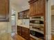 Gourmet kitchen featuring stainless steel double ovens, granite countertops, and custom wood cabinetry at 1222 Kings Bottom Dr, Fort Mill, SC 29715