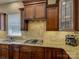 Modern kitchen equipped with granite countertops, a gas stovetop, and stylish tile backsplash at 1222 Kings Bottom Dr, Fort Mill, SC 29715