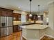 Spacious kitchen with stainless steel appliances, granite countertops, and dark wood cabinetry at 1222 Kings Bottom Dr, Fort Mill, SC 29715