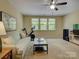 Spacious living room featuring a sofa, television and lots of natural light at 1222 Kings Bottom Dr, Fort Mill, SC 29715