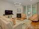 Cozy living room features a fireplace, large windows, and comfortable seating at 1222 Kings Bottom Dr, Fort Mill, SC 29715