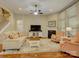 Inviting living room with a fireplace, plush seating, and ample natural light from large windows at 1222 Kings Bottom Dr, Fort Mill, SC 29715
