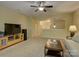 Spacious living room features neutral carpet, ceiling fan, and a half-wall separating from another area at 1222 Kings Bottom Dr, Fort Mill, SC 29715