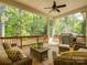 Inviting screened-in porch with ceiling fan, grill, and beautiful backyard views at 1222 Kings Bottom Dr, Fort Mill, SC 29715
