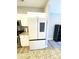 Modern kitchen featuring stainless steel appliances, granite countertops, and sleek white cabinetry at 126 Pleasant Hill St, Lancaster, SC 29720