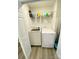 This laundry room features a white washer and dryer with wire shelving for convenient storage at 126 Pleasant Hill St, Lancaster, SC 29720