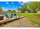 Backyard featuring a deck with chairs and a spacious grassy yard at 1279 Rocky Creek Rd, Shelby, NC 28152