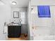 Small bathroom featuring a vanity, mirror, and a shower/tub combination with a shower curtain at 1279 Rocky Creek Rd, Shelby, NC 28152
