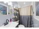 Charming bathroom featuring modern fixtures, decorative shelves, and stylish shower curtain at 1279 Rocky Creek Rd, Shelby, NC 28152