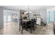 Cozy dining room featuring a square table with six chairs, a fireplace, and decor signs at 1279 Rocky Creek Rd, Shelby, NC 28152