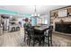 Charming dining area featuring a rustic table setting with a cozy fireplace and an open view to the kitchen at 1279 Rocky Creek Rd, Shelby, NC 28152