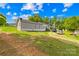 Spacious home with a large yard, multiple storage buildings, and driveway parking at 1279 Rocky Creek Rd, Shelby, NC 28152