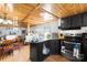 Kitchen featuring stainless steel appliances, wood paneling, and ample counter space at 1279 Rocky Creek Rd, Shelby, NC 28152