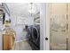 Modern laundry room featuring updated appliances, ample storage, and stylish decor for added convenience at 1279 Rocky Creek Rd, Shelby, NC 28152