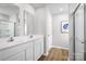 Bright bathroom with double sinks, modern fixtures, and a walk-in shower at 129 Millstream Dr, China Grove, NC 28023