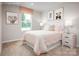 Cozy bedroom features a comfortable bed, neutral walls, and whimsical animal themed artwork at 129 Millstream Dr, China Grove, NC 28023