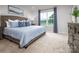 Inviting bedroom with a large window, comfortable bed, and ample storage space at 129 Millstream Dr, China Grove, NC 28023