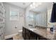 Bathroom featuring a granite countertop vanity and decorative blue rug at 13402 David Jennings Ave, Charlotte, NC 28213