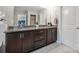 Bathroom featuring double sink vanity with granite countertop and ample storage at 13402 David Jennings Ave, Charlotte, NC 28213
