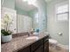 Bright bathroom featuring a granite countertop, and a decorative mirror at 13402 David Jennings Ave, Charlotte, NC 28213