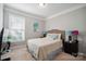 Cozy bedroom with a neutral color scheme, a window, and carpet flooring at 13402 David Jennings Ave, Charlotte, NC 28213