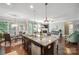 Bright, open kitchen with an island, stainless appliances, and hardwood flooring at 13402 David Jennings Ave, Charlotte, NC 28213