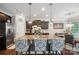 Well-designed kitchen featuring a granite island, stainless steel appliances, and dark cabinetry at 13402 David Jennings Ave, Charlotte, NC 28213