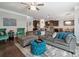 Inviting living area showcasing an open floor plan, hardwood floors, and stylish furniture at 13402 David Jennings Ave, Charlotte, NC 28213