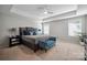 Serene main bedroom with tray ceilings, plush carpeting, and large windows at 13402 David Jennings Ave, Charlotte, NC 28213