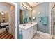 Bright bathroom featuring double sinks, ample counter space, and modern fixtures at 172 Harper Lee St, Davidson, NC 28036