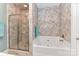Luxurious bathroom featuring a tub, separate shower, and designer tile at 172 Harper Lee St, Davidson, NC 28036