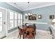 Bright breakfast nook featuring white shutters, tile flooring, and a charming chandelier at 172 Harper Lee St, Davidson, NC 28036