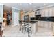 Beautiful kitchen with granite counters, stainless appliances, tile floors, and a breakfast bar area at 172 Harper Lee St, Davidson, NC 28036