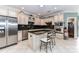 Stylish kitchen featuring granite countertops, stainless steel appliances, a center island, and custom cabinetry at 172 Harper Lee St, Davidson, NC 28036