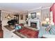 Dual living areas showing a piano in one space and a fireplace in the other at 172 Harper Lee St, Davidson, NC 28036