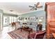 Bright living room featuring elegant furnishings, including a sofa, chairs, and decorative rug at 172 Harper Lee St, Davidson, NC 28036