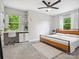 Serene bedroom featuring a built-in desk, natural light, and carpet at 1758 Bridlewood Ct, Gastonia, NC 28054